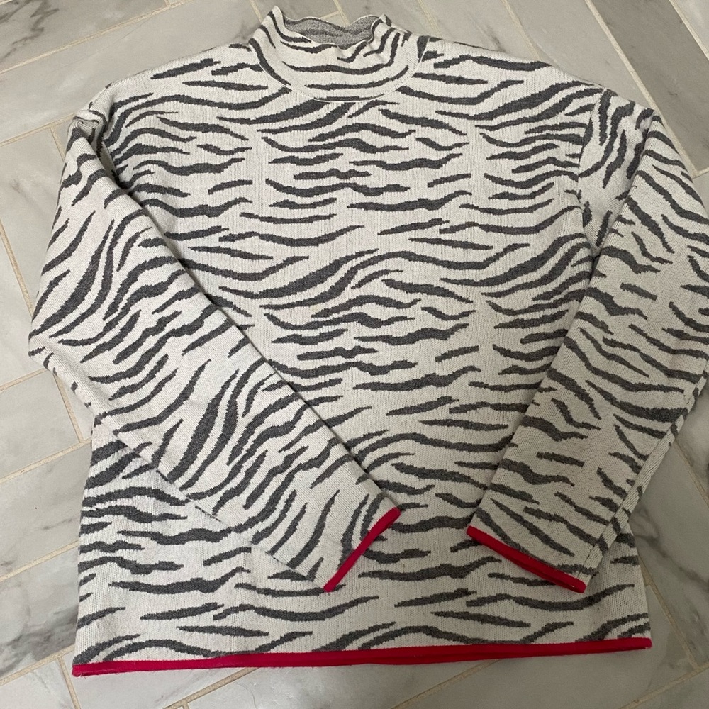 Super soft Anthropologie mock neck sweater. Animal print